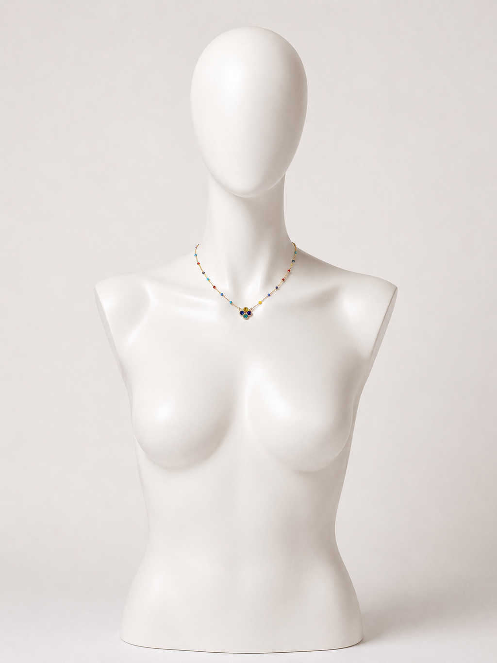 Collana dorata con fiore e cristalli multicolor
