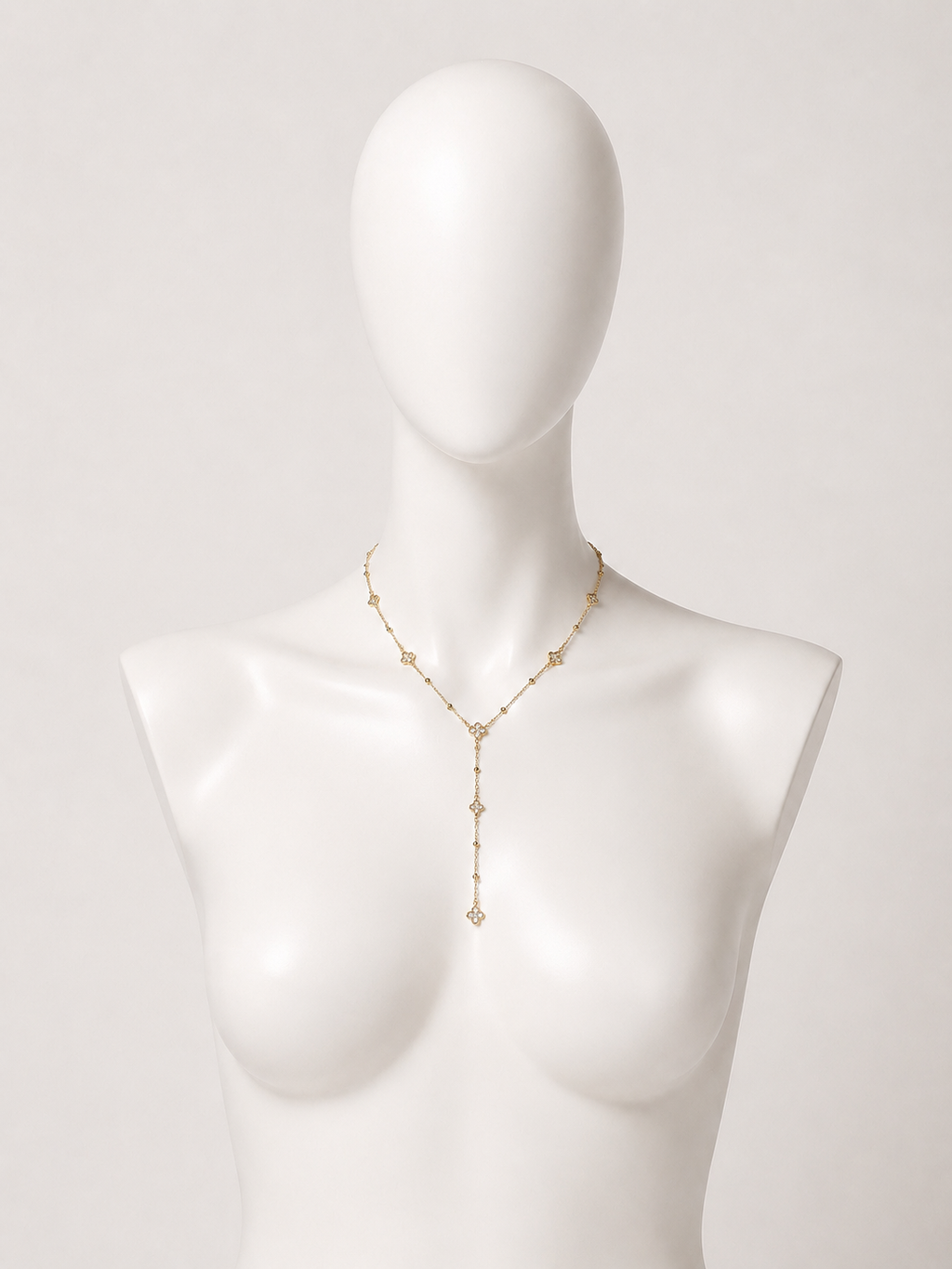 Collana a Y dorata con fiori e cristalli