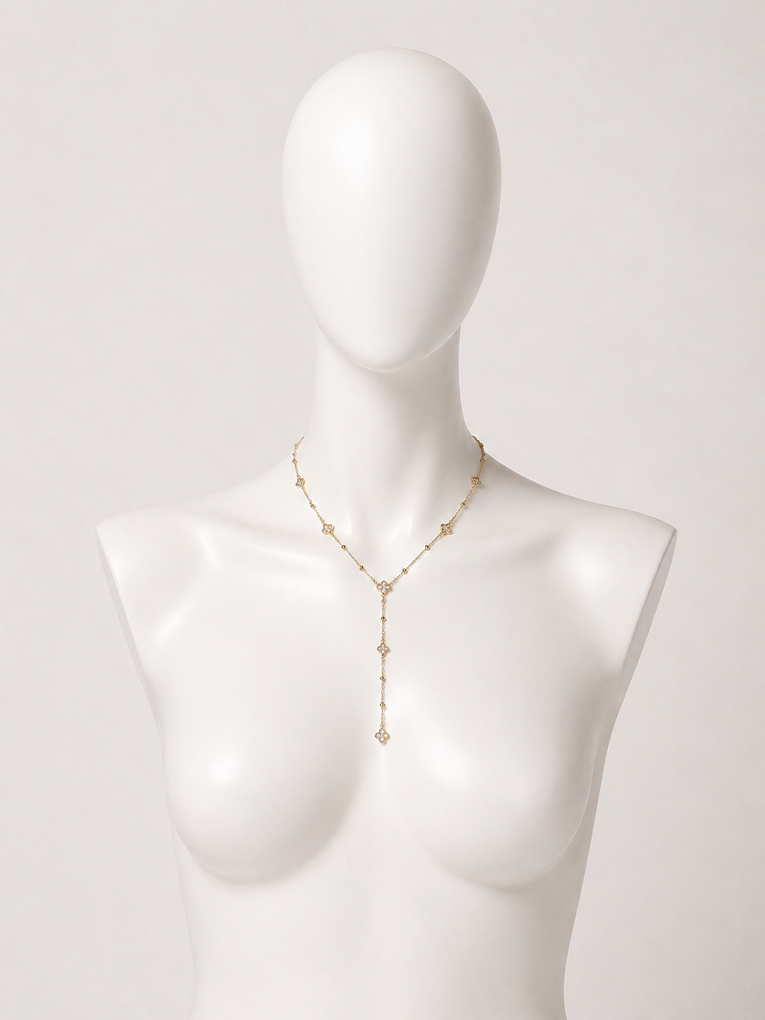Collana a Y dorata con fiori e cristalli