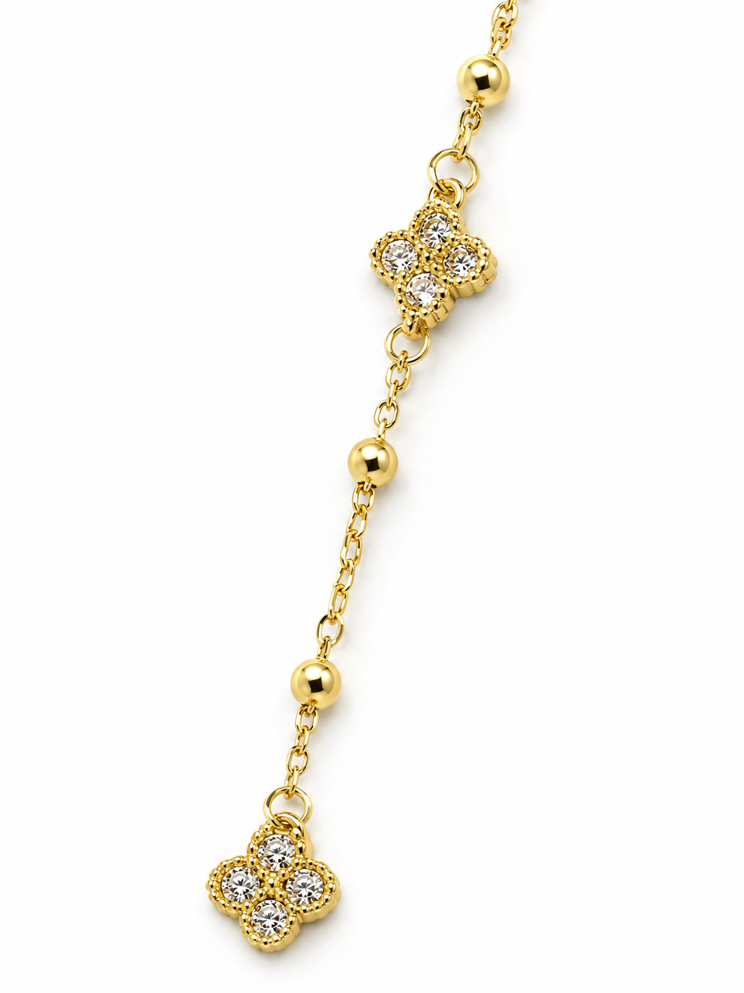 Collana a Y dorata con fiori e cristalli