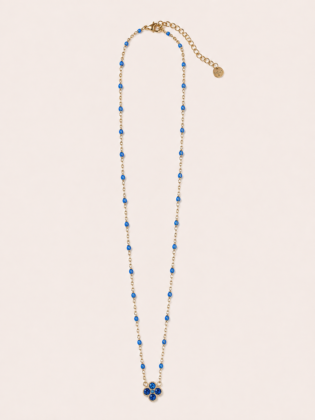 Collana dorata con fiore e cristalli blu